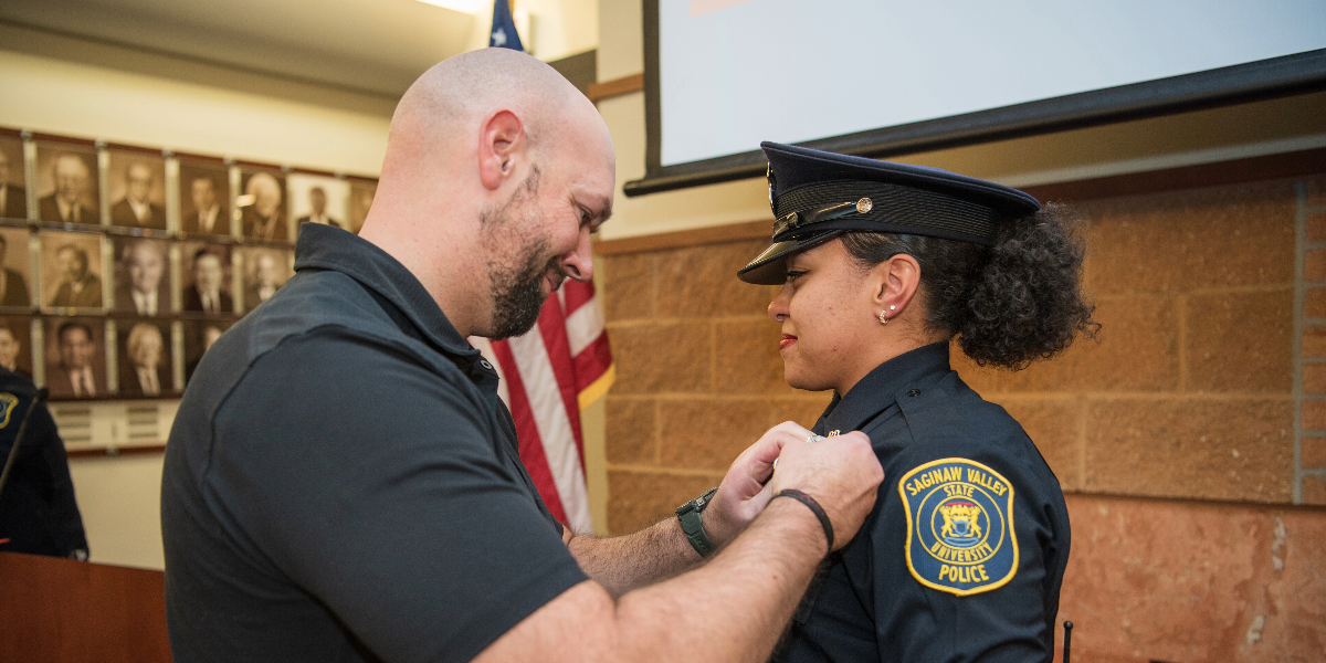 A university officer being sworn in